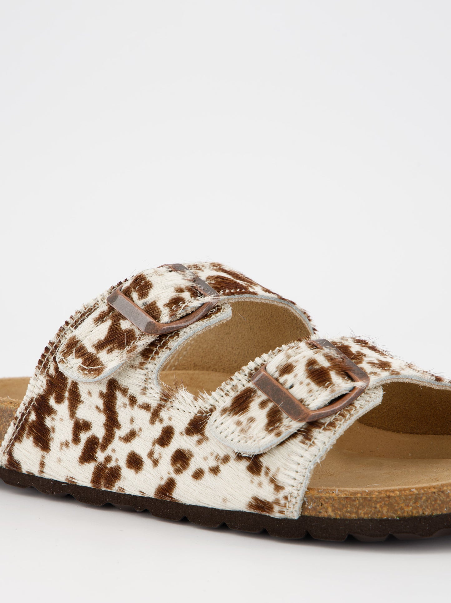 Sandalias planas de pelo con estampado animal