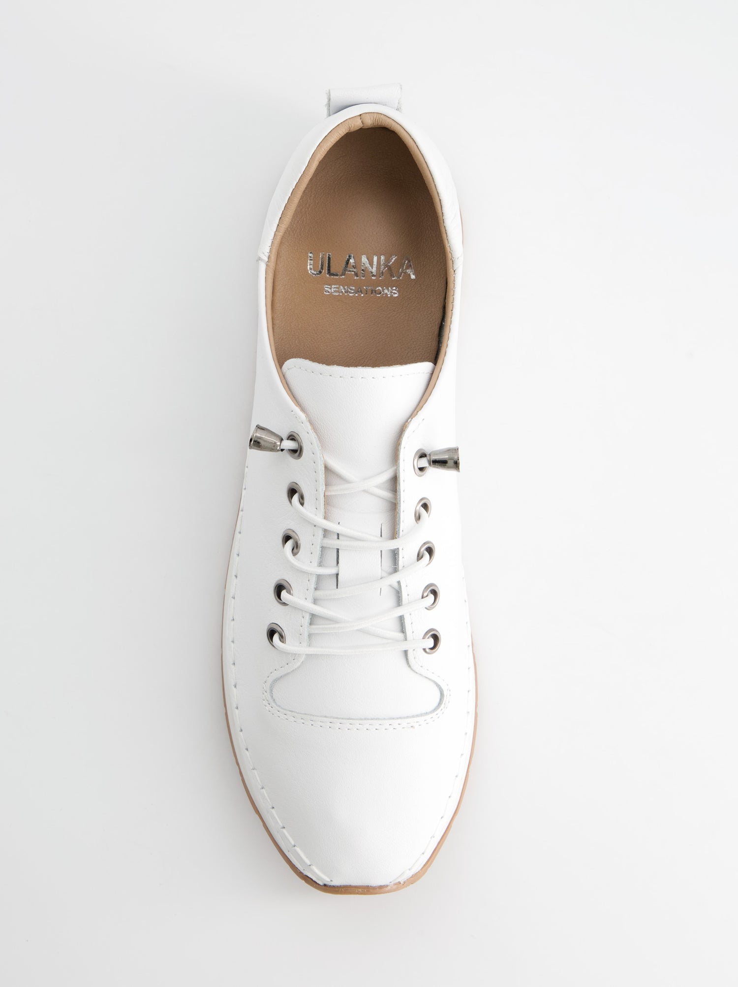 Zapatillas blancas en piel con cordones elásticos  032 001