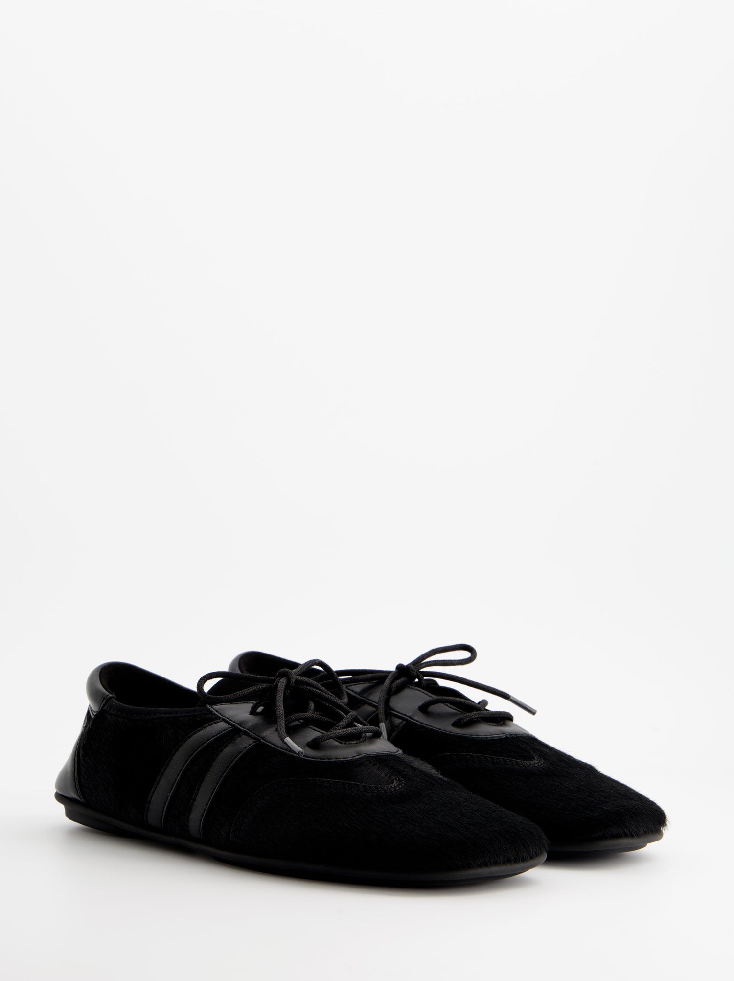Zapatillas negras de pelo - ULK Lia